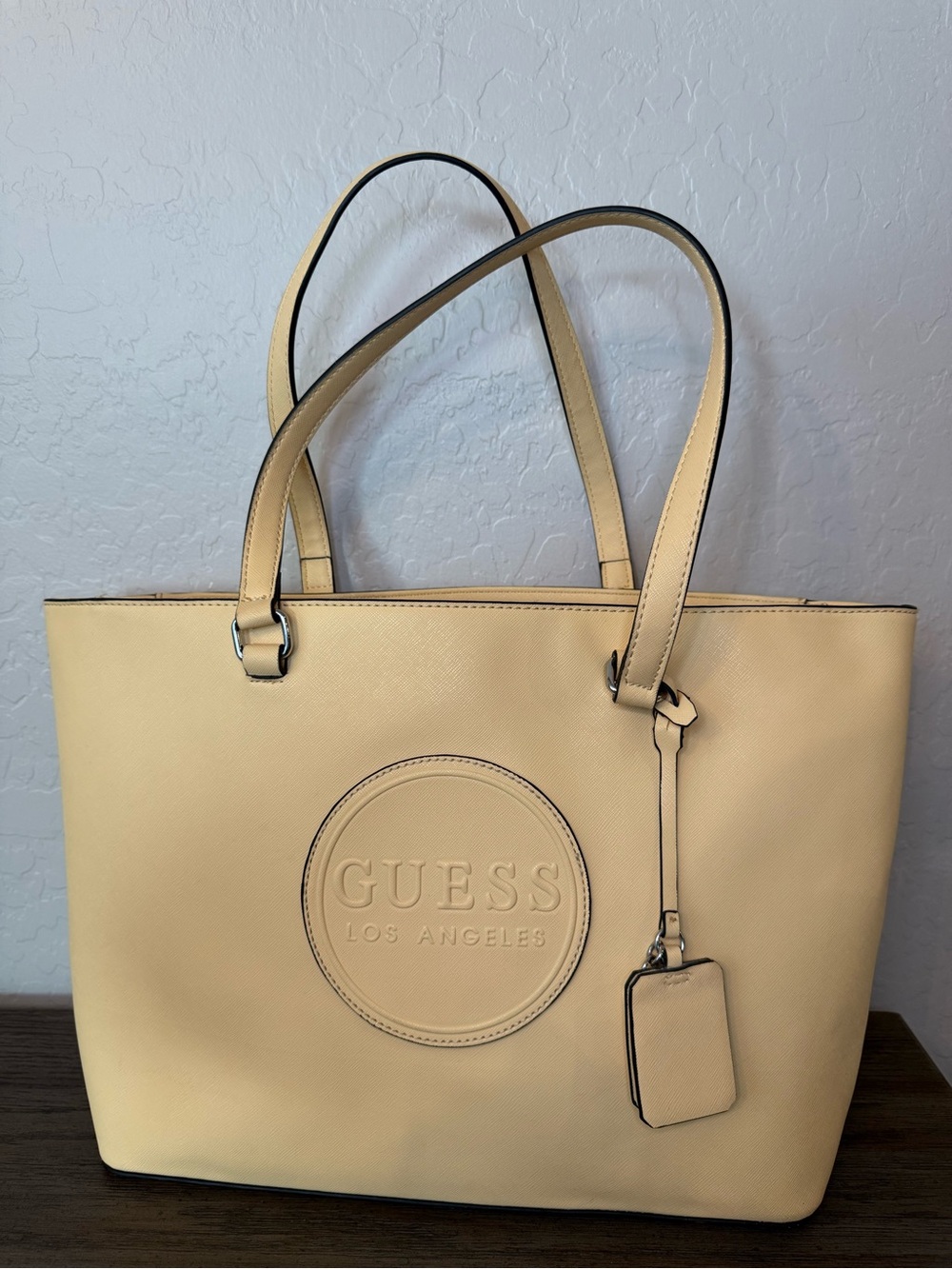 GUESS Cream Tote with Circular Embossed Logo